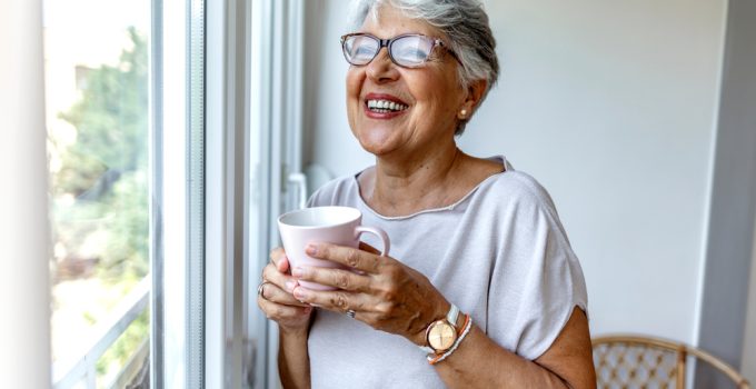 Senior,Woman,Drinking,A,Beverage,At,Home.,Charming,Elderly,Woman